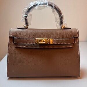 Genuine Epsom Leather mini handbag with shoulder strap featuring Gold hardware